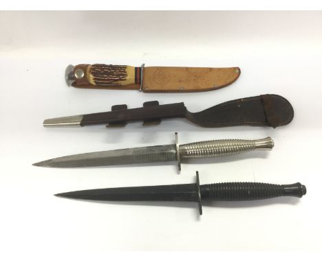 Three daggers including a Wilkinson Sword example. Shipping category D.