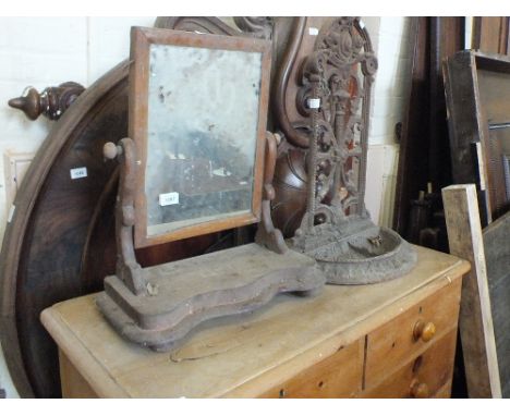 A Victorian iron stick stand and a toilet mirror