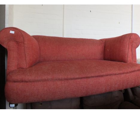 A Victorian red upholstered two seat sofa