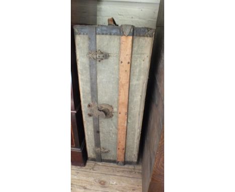 A metal bound cabin trunk