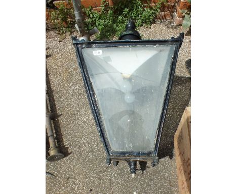 A black painted copper street lantern on stand