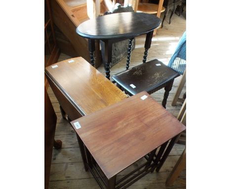 A small oak gateleg table, a barley twist occasional table, a nest of three tables and a stool