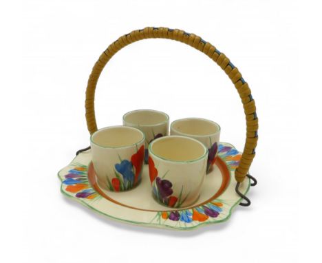 A CLARICE CLIFF BIZARRE LEDA SHAPE CROCUS PATTERN EGG CUP STAND  with four egg cups and bound metal wire handle Condition Rep