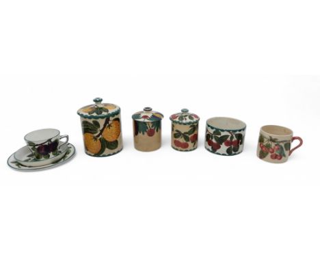 A COLLECTION OF WEMYSS POTTERY including a plum decorated trio, a cherry painted preserve pot and lid, a cherry painted pot, 
