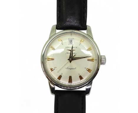 A LONGINES AUTOMATIC CONQUEST with a brushed silvered dial gold coloured chevron numerals and dauphin hands and a date apertu