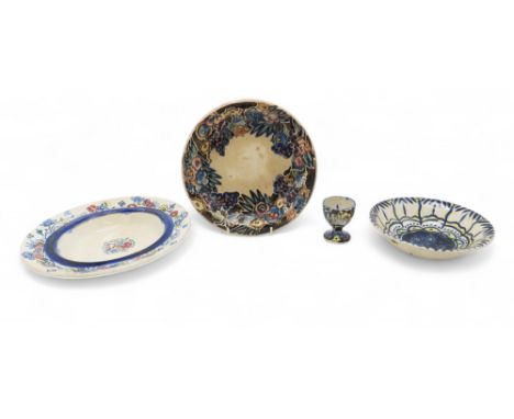 JESSIE M KING (SCOTTISH 1875-1949) A group of pottery pieces to include an egg cup painted with flowers, 6cm high, a bowl wit