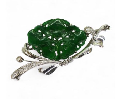 A CHINESE GREEN HARDSTONE BAT BROOCH mounted in 18k white gold foliate mount set with diamonds. dimensions 5.5cm x 2.8cm. Wei