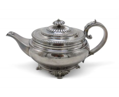 PAUL STORR; A George III silver coffee pot, London 1811, of squat baluster form, with an egg and dart border, a scroll-capped