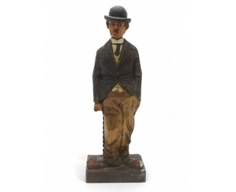 A CARVED WOOD WHISTLING CLOCKWORK AUTOMATON FIGURE OF CHARLIE CHAPLAIN Possibly by Karl Griesbaum, measuring approx. 34cm in 