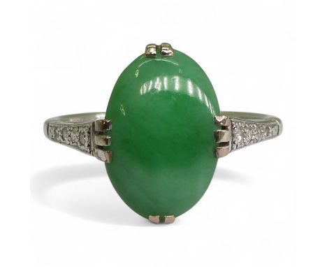A CHINESE GREEN HARDSTONE & DIAMOND RING the mount in 18ct white gold and platinum, hardstone approx 13mm x 9mm x 4.1mm, the 