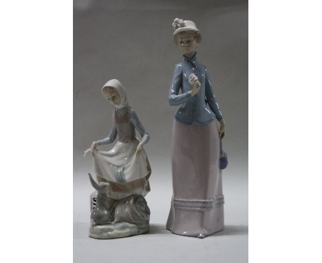 TWO LLADRO FIGURES, 'Rabbits Food', impressed 'D-18 J' to base and young woman holding rose and bag (2)
