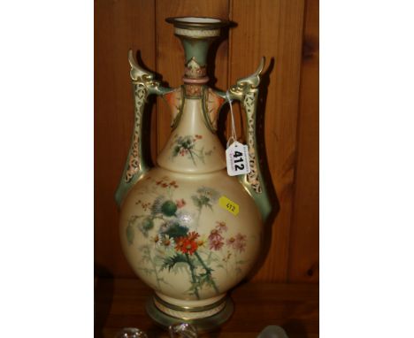 A ROYAL WORCESTER PORCELAIN TWIN HANDLED VASE, decorated with thistles and flowers on cream ground with pierced handles, puce