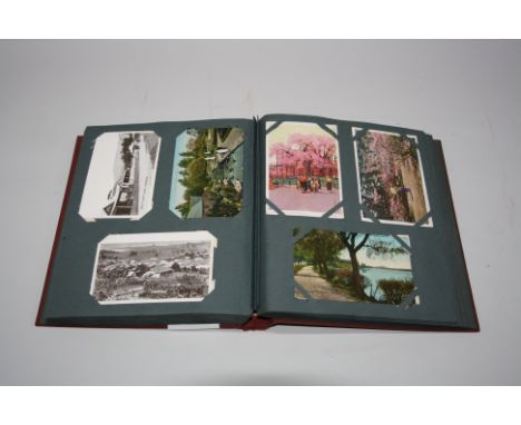 A POSTCARD ALBUM, to include Australia/New Zealand, British Warships, Japan etc