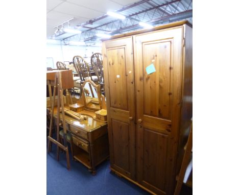 A PINE DUCAL TWO DOOR WARDROBE, dressing table with swing mirror and a stool, bedside unit and a double headboard (6) (key) 