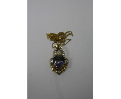 A 9CT GOLD PENDANT NECKLACE, with oval central mystic topaz within a decorative surround, length of chain 26cm, hallmarks for