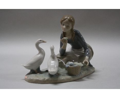 A LLADRO FIGURE GROUP, 'Feeding The Ducks', impressed 'P-24 A' to base