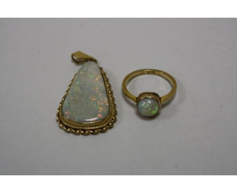 TWO ITEMS OF JEWELLERY, to include a large opal pendant, together with a ring, stamped 9ct, ring size M