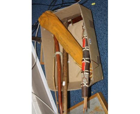 A WWII KITE, a bow and arrows, a pick axe and two daggers