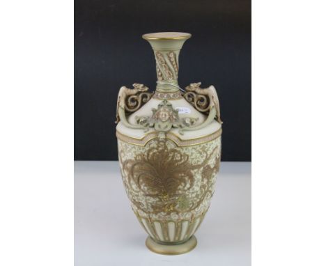 Early 20th century Royal Worcester blush ivory vase with bird of paradise and griffin decoration, puce mark to underside 34cm