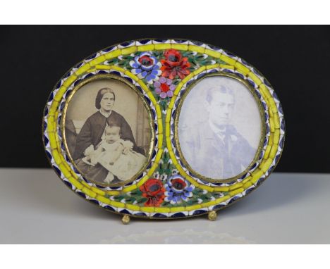 A vintage brass backed micro mosaic double aperture photograph frame.