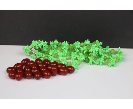 A vintage German Christian Dior 1967 Costume Necklace together with a bag of loose vintage cherry colour beads.