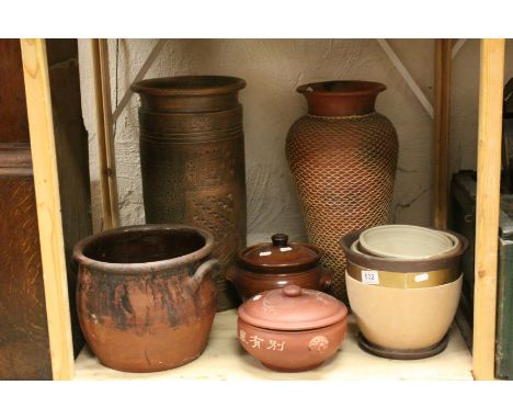 Oriental terracotta lidded pot, a similar stoneware pot, a stoneware crock, a balustre shaped vase, jardinieres, studio potte