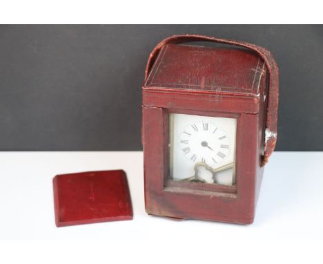 A brass carriage clock stored within its original case, retailed by Carrington &amp; Co, Regent St, London.
