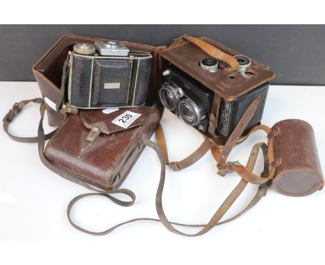 A vintage cased Microcord medium format camera together with a a vintage cased Westex camera.