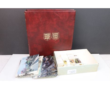 A Collection of Jersey stamps contained within an album together with a selection of vintage cigarette cards and a quantity o