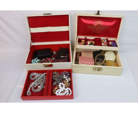 Two vintage jewellery boxes containing a selection of jewellery and watches to include silver examples.