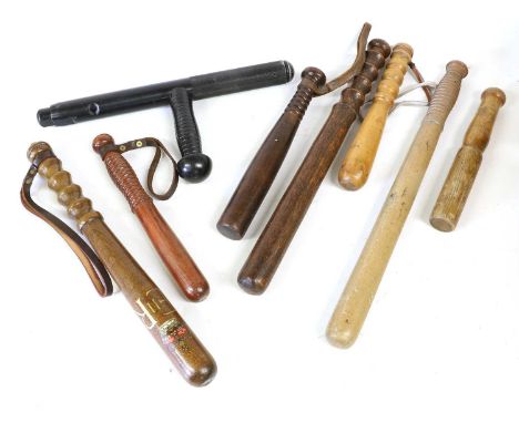 An Elizabeth II Wood Police Truncheon, with stencilled crowned EIIR cypher, ribbed grip and leather wrist strap; also, six va