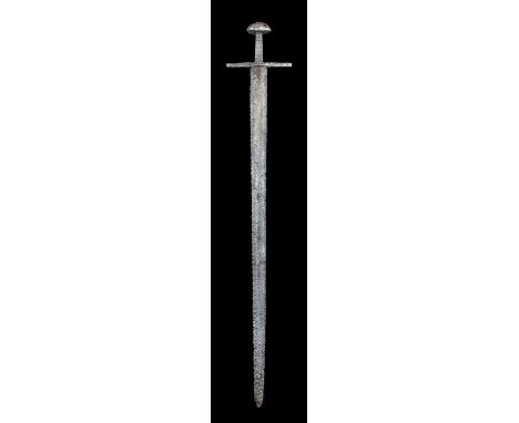 A Fine Late Viking Sword, second half of the 10th century, of Petersen Type X, the 83cm broad pattern welded steel blade with