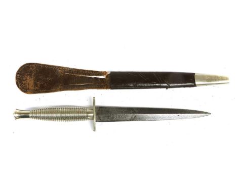 A Second World War Commando Dagger, Second Pattern, the 7cm double edge steel blade with raised medial ridge, etched WILKINSO