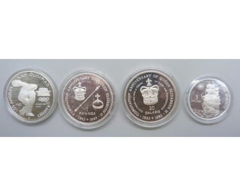 Four silver coins, 1983 USA L.A Olympics, Tonga &amp; Gambia 1993 coronation anniversary coins and a $5 'The Bounty Coin'