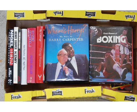 Four boxes of boxing related books, mainly hardbacks to include Peter Arnold's The Pictorial History of Boxing, Peter Heller'