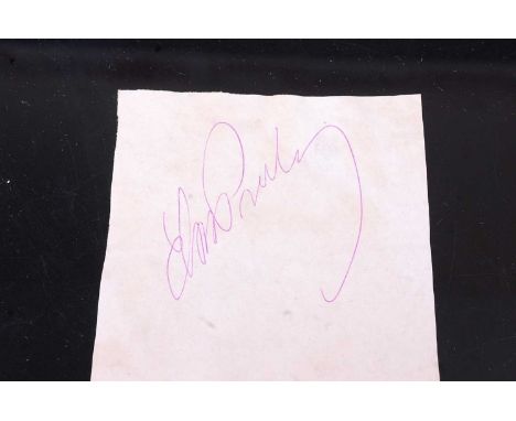 Elvis Presley, autograph in pink ink on paper, together with a typed letter of provenance from Judy White, employee at The La