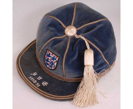 An England International football cap, awarded to Sir Alfred (Alf) Ramsey, in blue velvet with silver braid and tassle with e