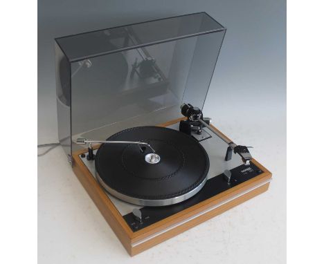 A Thorens TD 160 turntable, having a teak case and removeable perspex cover, GB Pat No. 1.082.746, Serial B No. 1717 B2, w.44