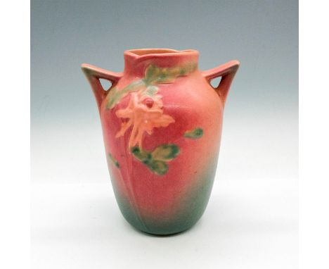 Glazed finish over pink body blending into green with raised floral design in lighter pink and green. Roseville Pottery raise