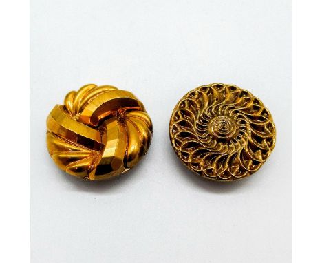Round gilded gold shirt buttons with a swirl design.This item has no reserve. Dimensions: 0.25"W x 1"Dia.Condition: Age relat