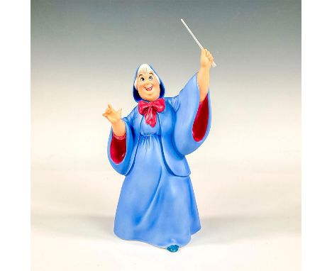 Porcelain figure with matte finish. Depicts the Cinderella's Fairy Godmother holding her magic wand up high. Walt Disney Clas