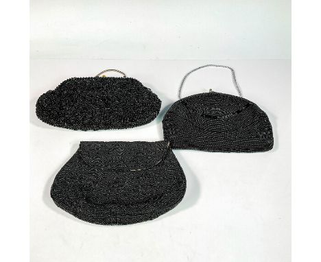 An assortment of beautiful stylish vintage purses with hand sewn beadings. Each purse with brand fabric tag sewn inside. The 