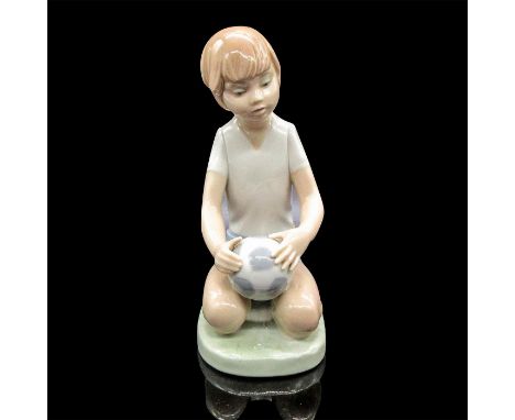 In soft colors with glazed finish. Nao by Lladro backstamp. Dimensions: 2.5"L x 3.5"W x 6"HManufacturer: Nao by LladroCountry