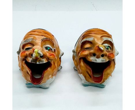 Two vintage ashtrays modelled as a man's head with a funny expression as a bee is perched on his nose. Dimensions: 4.25"L x 3