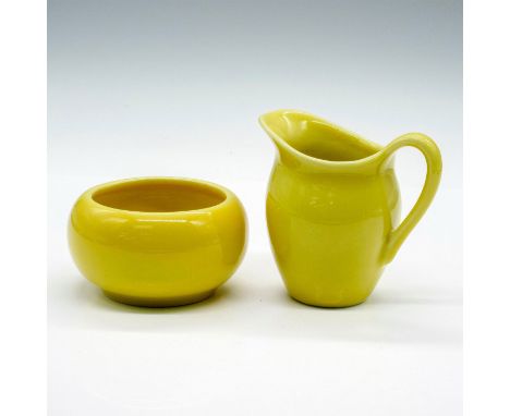 Yellow creamer and sugar bowl set. Largest piece measures 3.5"L x 2"W x 3.5"H. Issued: 1953Manufacturer: Rookwood PotteryCoun