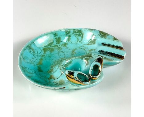 Turquoise toned with lustre finish &amp; branch patterning. Brass accented Dutch clogs and trim.Includes carved-in snuffer ho