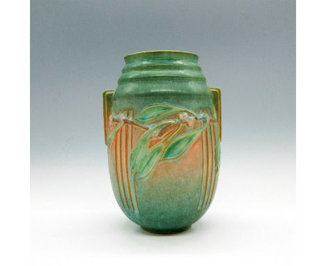 Matte finish over light greens with tawny colored geometric design. Dimensions: 5"L x 4"W x 7.5"HCountry of Origin: United St