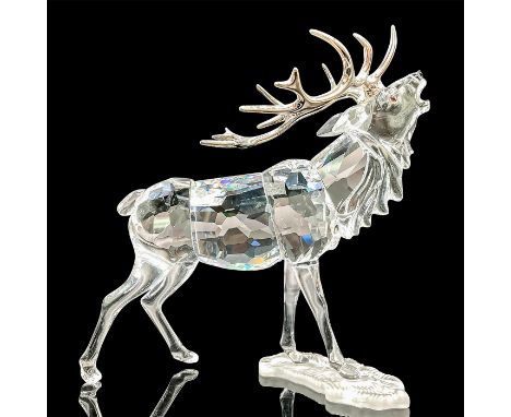 Part of the of the Rare Encounters group. A clear faceted deer with black nose, Siam topaz eyes, and silver-tone metal antler