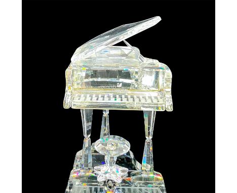 Part of the Crystal Melodies collection. Lead crystal piano and stool made from faceted and unfaceted clear crystal. Swarovsk