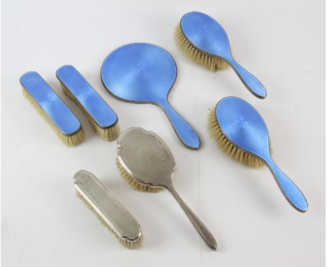 Engine turned blue enamel dressing table set comprising, hand mirror, two hair brushes and two clothes brushes, London 1932, 